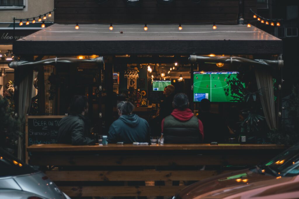 People watching football in a pub